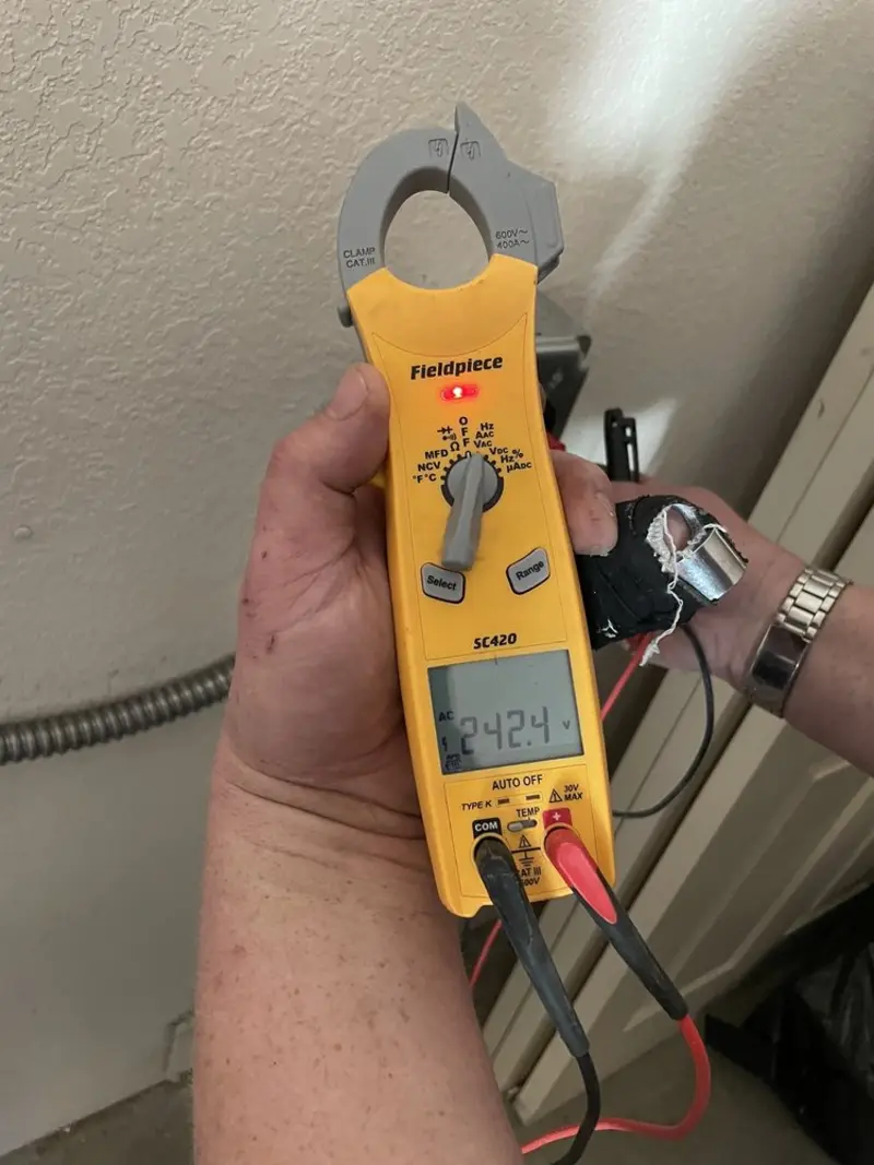 Voltage testing with clamp meter during Electrical Installation Services in South Glens Falls